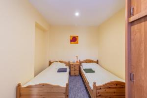 A bed or beds in a room at Déli Terasz A Apartman Free parking, self-check-in anytime