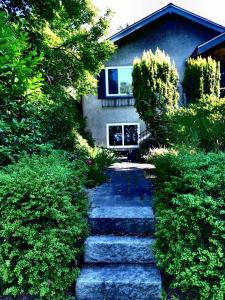 a stone path in front of a house at Neat, compact, private room in a lovely Vancouver neighbourhood in Vancouver