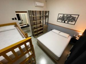 Cantinho Estrelado - Casa automatizada com ALEXA客房内的一张或多张床位