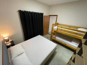 Cantinho Estrelado - Casa automatizada com ALEXA客房内的一张或多张床位