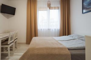 Posteľ alebo postele v izbe v ubytovaní apartament dla 4 osób blisko morza