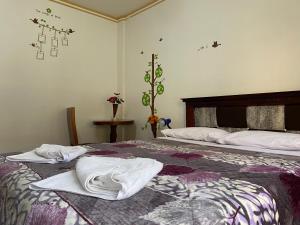 Postel nebo postele na pokoji v ubytování Hostal Arauco
