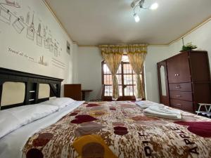 Postel nebo postele na pokoji v ubytování Hostal Arauco