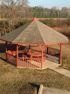 a gazebo with a picnic table and a roof at Americas Best Value Inn Cabot in Cabot
