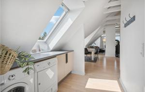 a laundry room with a washer and dryer in a house at Stunning Apartment In Blvand With 1 Bedrooms And Wifi in Blåvand