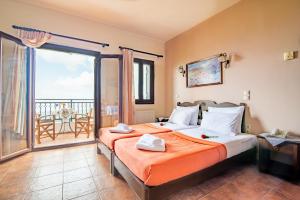 Postel nebo postele na pokoji v ubytování Hotel Marina