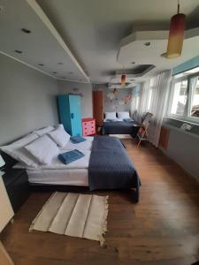 Posteľ alebo postele v izbe v ubytovaní Dom wypoczynkowy Led