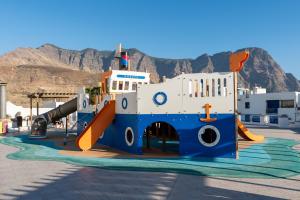 a playground with a slide and a slideintend at Agaete White&Blue Rooftop in Agaete