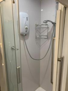 a shower in a bathroom with a shower at One bedroom apartment in heart of brighton in Brighton & Hove