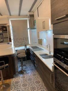 a kitchen with a sink and a stove top oven at One bedroom apartment in heart of brighton in Brighton & Hove