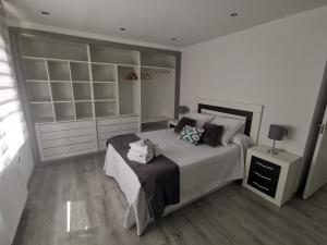 Łóżko lub łóżka w pokoju w obiekcie A CASA DO LADO