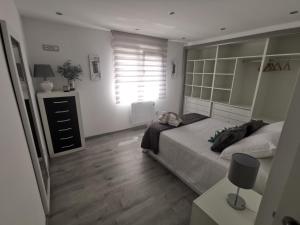 Łóżko lub łóżka w pokoju w obiekcie A CASA DO LADO