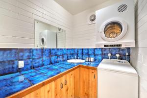 a bathroom with a blue tiled counter and a sink at Snow Ski Apartments 19 in Falls Creek
