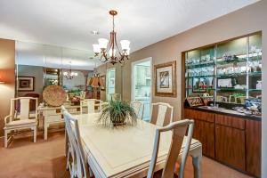 a dining room and kitchen with a table and chairs at Fairway Oaks Villa Condo in Amelia Island