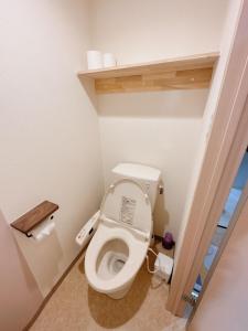 a bathroom with a toilet with the lid up at 三米-黒門市場-黑门市场-kuromon 202タイプ in Osaka