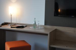 TV a/nebo společenská místnost v ubytování Euro Hotel Friedberg