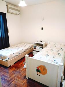 En eller flere senge i et værelse på Departamento Céntrico Ciudad Mendoza Belgrano y Aristides con cochera