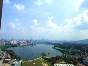 a view of a river with a city in the background at Astetica 3 Bedrooms in Seri Kembangan