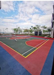 a tennis court with red and blue at Astetica 3 Bedrooms in Seri Kembangan