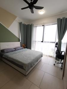 a bedroom with a bed and a ceiling fan at Astetica 3 Bedrooms in Seri Kembangan