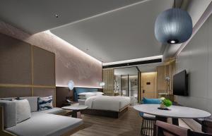 Postel nebo postele na pokoji v ubytování Qinhuangdao Marriott Resort