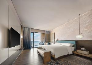 TV a/nebo společenská místnost v ubytování Qinhuangdao Marriott Resort