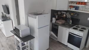 Η κουζίνα ή μικρή κουζίνα στο Apartman Sunce +21 φωτογραφίες