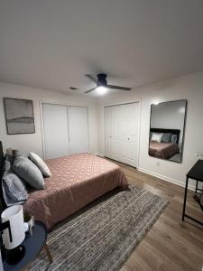 a bedroom with a bed and a ceiling fan at Spacious & Cozy - Close to Fort Moore - Pool Table in Columbus