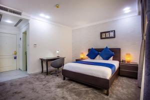 Postel nebo postele na pokoji v ubytování Al Basem Hotel