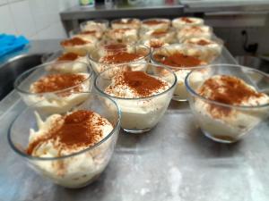 a bunch of desserts in glass bowls on a counter at Refuge de Roncharel in Annot