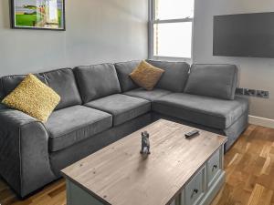 a living room with a couch and a coffee table at The Lookout in Scarborough