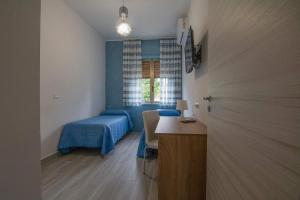 Ένα ή περισσότερα κρεβάτια σε δωμάτιο στο Casa Vacanze B&B da Emiliano Paestum