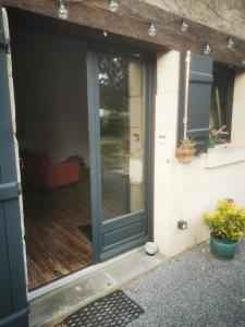 a sliding glass door on a patio at Appartement Indépendant à Terrerort in Saumur