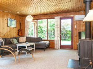 a living room with a couch and a table at 6 person holiday home in Grenaa-By Traum in Brøndstrup