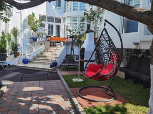 a swing in the yard of a house at Fitness House with garden in Constanţa