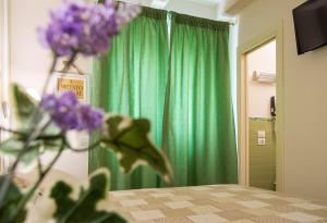 Un pat sau paturi într-o cameră la Il Giglio Verde