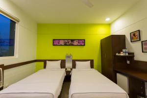 Ένα ή περισσότερα κρεβάτια σε δωμάτιο στο Ginger Noida 63 +33 φωτογραφίες