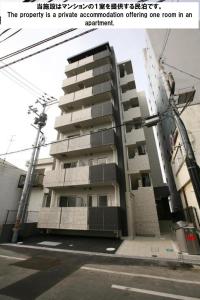 a apartment building with the words the property is a private accommodation offering room at Cocostay KO Residence Sennichimae3Fココステイ ケーオーレジデンス センニチマエ3F in Okayama