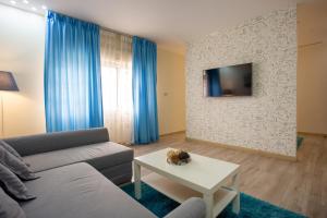 a living room with a couch and a table at Al Basem Hotel in Amman