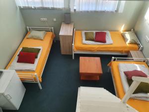 a room with two bunk beds and a table at Freedom65 Hostel and Caravan in Tallinn