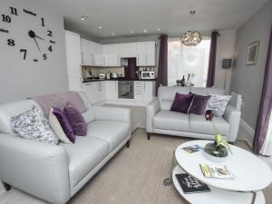 a living room with two couches and a table at Portland View in Bristol
