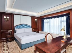 Letto o letti in una camera di Guangming CIMC Executive Hotel Shenzhen