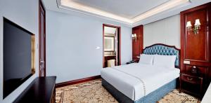 Letto o letti in una camera di Guangming CIMC Executive Hotel Shenzhen