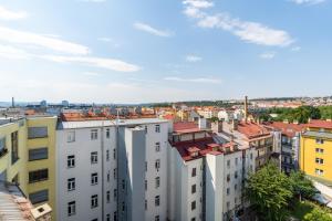a view of a city from a building at Brand new two room apartment #64 in Elite Rezidence with free secure parking in Prague