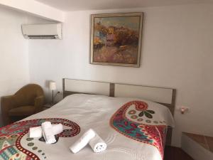 a bedroom with a bed with towels on it at Apartamento Villa Joya in Benissa +38 photos