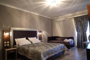 Postel nebo postele na pokoji v ubytování Hotel Souita
