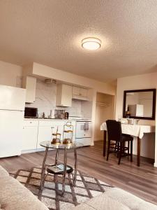 a kitchen and living room with a table and chairs at North Star Place 11 in Fairbanks