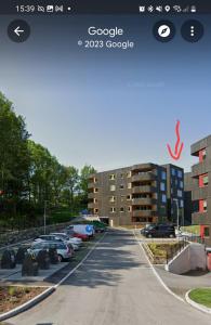 a picture of a street with cars parked in a parking lot at 7,3sq mts room -Forests cozy house in Stavanger