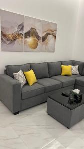 a living room with a couch and a coffee table at dana hotel apartments in Taif