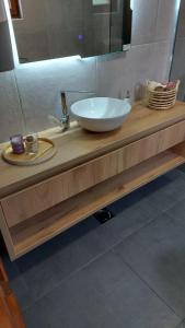 a bathroom counter with a sink and a mirror at House_Zoi in Čelinac